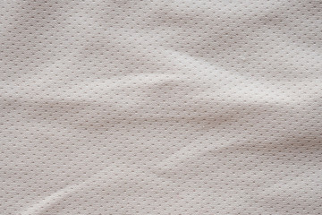 White fabric sport clothing football jersey with air mesh texture background