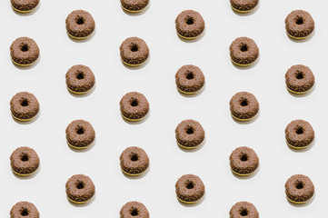 Fototapeta premium Bakery pattern with chocolate donuts