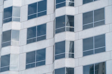 Office leasing concept. Windows of modern office building close up