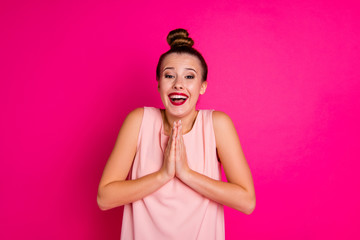 Close-up portrait of her she nice-looking charming attractive lovely lovable cheerful cheery girl begging new gift folded hands isolated on bright vivid shine pink fuchsia background