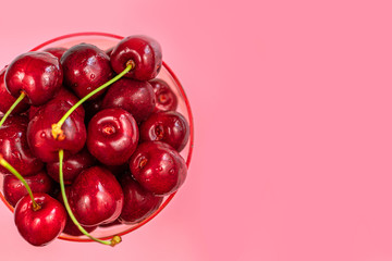 cherry berries on a pink background