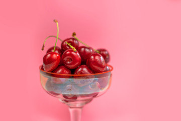 cherry berries on a pink background