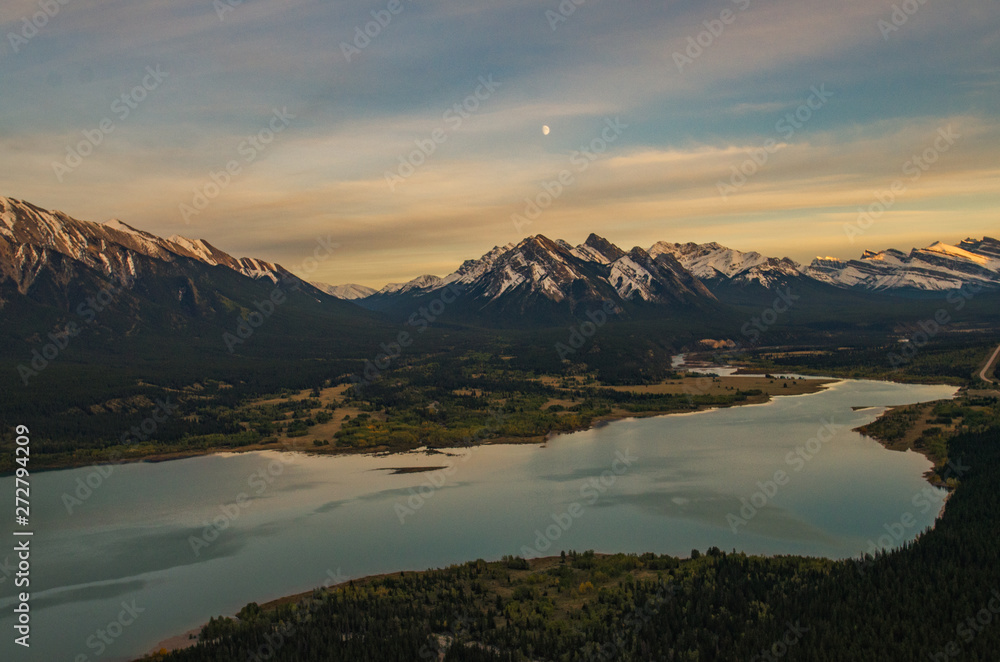 Wall mural epic helicopter flight during sunset at the abraham lake in canada