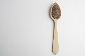 wooden spoon with black chia seeds