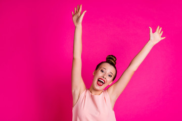 Portrait of attractive lovely cute pretty lady raise hands arms feel positive cheerful dressed top-knot modern youth outfit isolated vibrant background
