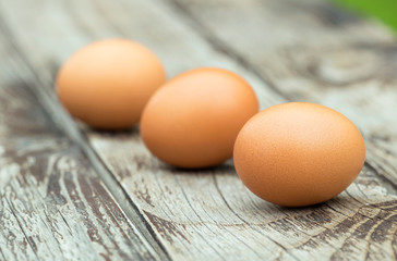 Breakfast ingredient, close-up of fresh eggs on a wooden table