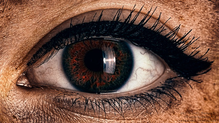 female fiery eye closeup with gothic makeup. beautiful eye