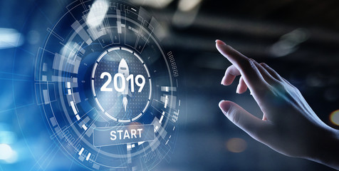 New year 2019 start button on virtual screen hologram. FInancial growth and new perspective in...