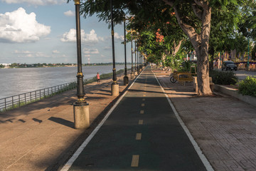 Bicycle road parallel to the river in one city in Thailand