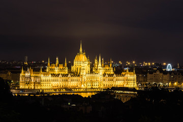 Fototapeta na wymiar Illuminated aerial urbanscape of Budapest with the Parliament building at the Danube River by night.