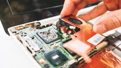 Electronic warranty service. Closeup of disassembled laptop. Replacement of the broken parts.