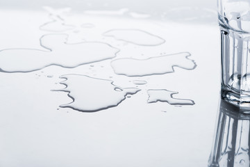glass and water stains on light surface with copy space