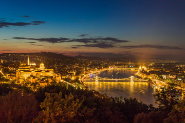 Fototapeta na wymiar Aerial beautiful illuminatetd urbanscape with the Danube river of Budapest, the main city of Hungary in Europe by night.