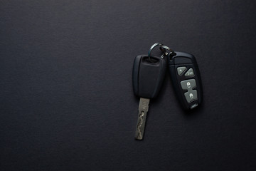 Car keys with remote from car alarm on isolated black background