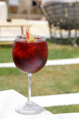 Glass of fresh Sangria with ice on a sunny day
