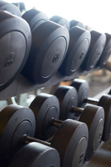 Fototapeta na wymiar Sports equipment barbells in the gym
