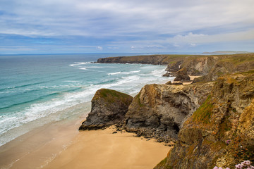 steep coast in cornwall with blue sky 