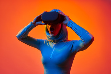 Futuristic woman in VR glasses screaming