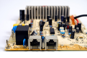 Old and dirty Electronic circuit board close up.