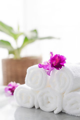 Towels on table with copy space blurred bathroom background. For product display montage.