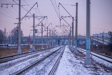 Winter Russian Railway. Public transport. winter road. Rails and sleepers. Electricity