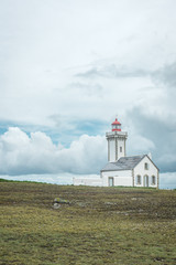 Fototapeta na wymiar Lighthouse under threatening sky in Brittany, France