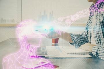 AR hologram with man working on computer on background. Augmented reality concept. Double exposure.