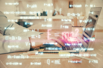 Science formula hologram with man working on computer on background. Education concept. Double...