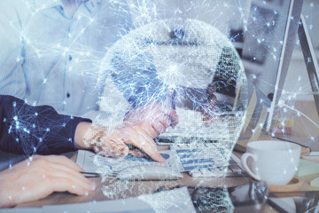 Man with computer background with brain theme hologram. Concept of brainstorm. Double exposure.