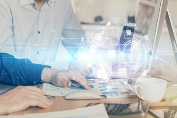 Social network theme hologram with businessman working on computer on background. Multi exposure.