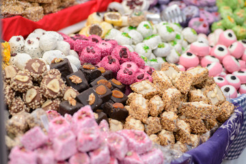 Fototapeta premium Various decorative handmade sweets, desserts in multiple colors form