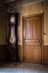 Door and grandfather clock from old french farmhouse
