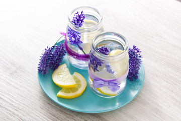Obraz na płótnie Canvas Lavender lemonade drink on white wooden table