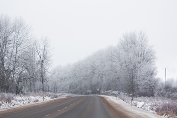Fototapeta na wymiar Winter Russian asphalt road. Winter road. Snowy road. Journey .
