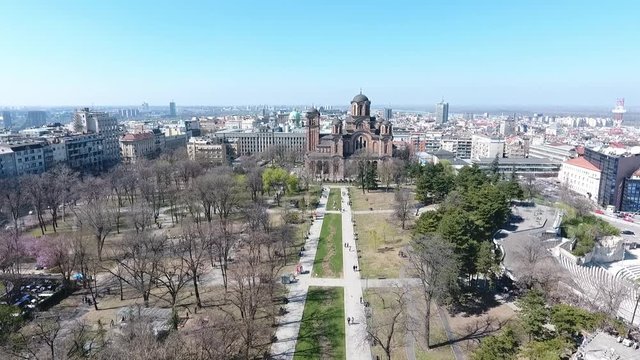 Aerial view of Tasmajdan park in the Belgrade city the capital of Serbia with Serbian Orthodox Church of Saint Marko  building and people walking view from above