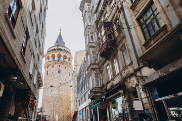 Naklejka premium street perspective. Galata tower and street in the old city of Istanbul, Turkey.