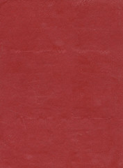 Artificial leather texture. Red old book cover. Rough surface with embossed. Blank retro page. Empty place for text. Perfect for background and vintage style design.