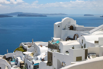 Santorini oia fira caldera classic view in the middle of the sunny day. Traditional greek white houses.