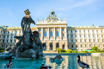 Fototapeta na wymiar Ministry of Justice of Bavaria Building with Neptunbrunnen fountain in Munich
