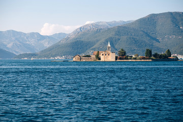 Adriatic Sea, Montenegro. View of a small church on the island of St. George in the Bay of Kotor,...