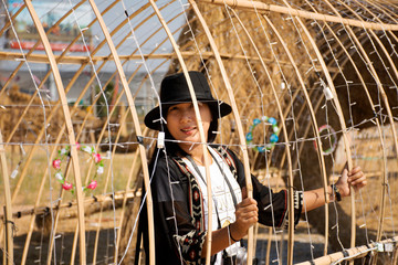 Travelers thai women people travel visit and posing portrait for take photo straw puppets or straws...