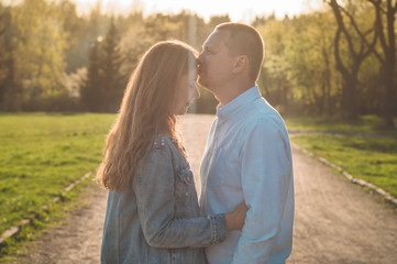 Fototapeta premium A young couple spends time together outdoors. Couple having fun summer time