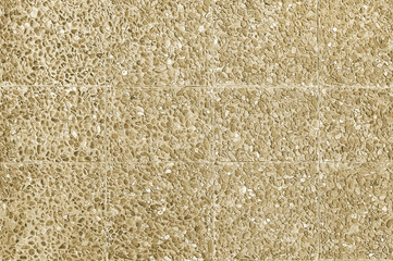 Old beige stone pavement background