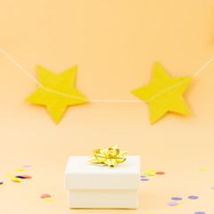 Birthday gift with stars and confetti