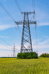 electricity pylons in field