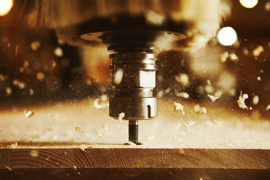 Close-up shot of machine with numerical control cuts wood. Cnc tool.