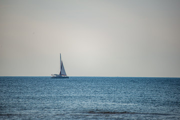 Fototapeta premium empty white sand beach with no people with boat