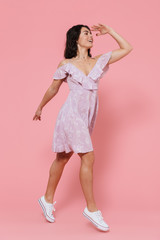 Full length of a smiling young girl wearing summer dress