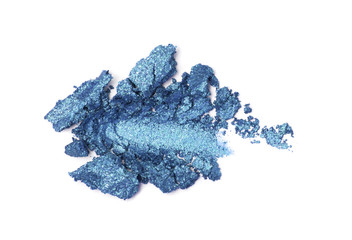 A broken blue gradient colored eye shadows isolated on a white background. Top view, flat lay. Copy space for your text