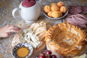 delicious village Breakfast - pita bread, cherries, strawberries, cheese, honey, sausage. selective focus. 